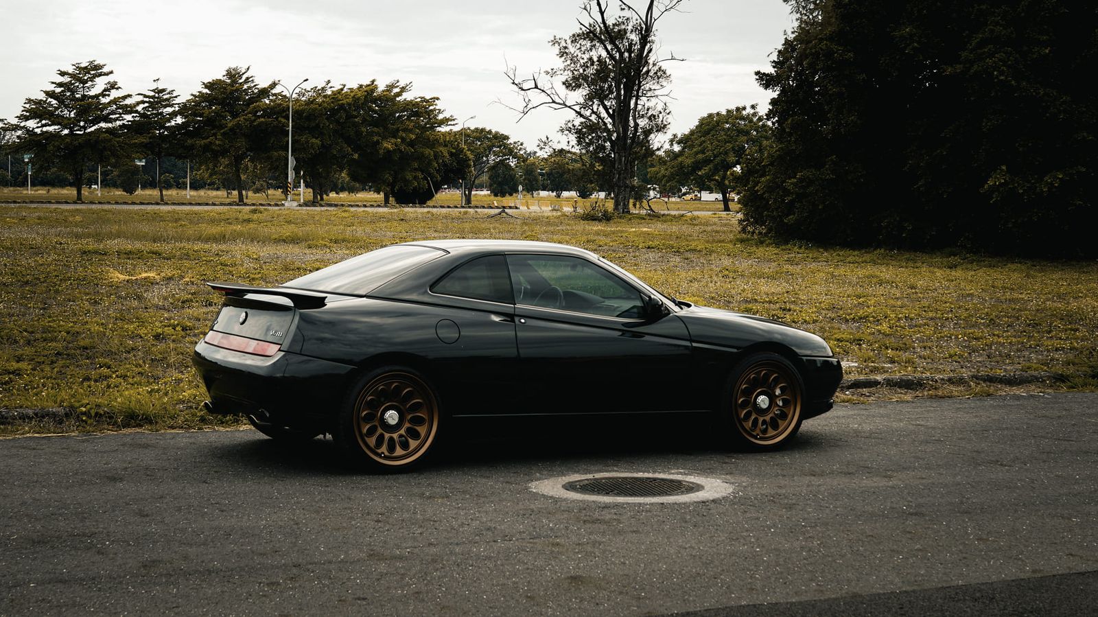 Alfa Romeo 916 GTV Black on Jaeges RA wheels